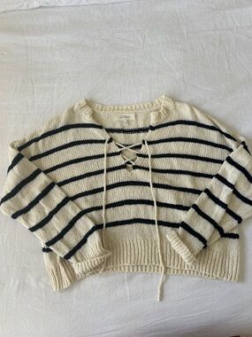 THE GREAT. Cream and Black Striped Lace-Up V-Neck Sweater